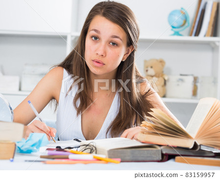 Woman is writing a review of novel Woman is writing a review of novel 83159957