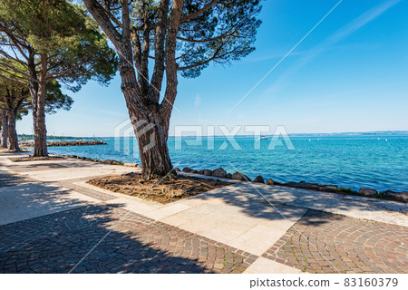 Lakeshore of Lake Garda in Lazise village - Verona Veneto Italy Lakeshore of Lake Garda in Lazise village - Verona Veneto Italy 83160379
