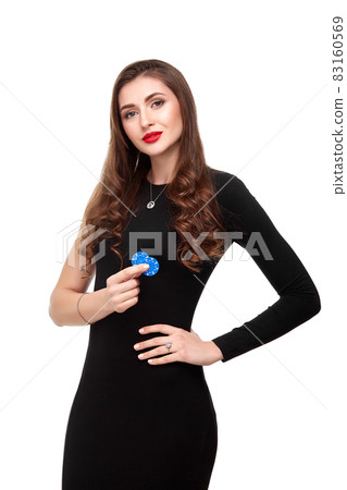 Sexy curly hair brunette posing with chips in her hands, poker concept isolation on white background Sexy curly hair brunette posing with chips in her hands, poker concept isolation on white background 83160569
