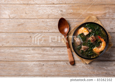 Beef, okra stew and spinach soup in bowl 83162102
