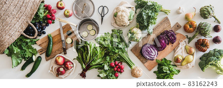 Table with fresh seasonal vegetables, greens Table with fresh seasonal vegetables, greens 83162243