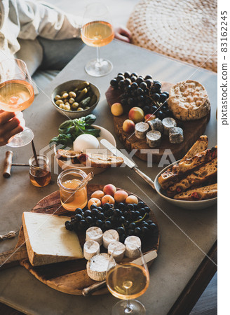 Glasses with orange or rose wine and various Glasses with orange or rose wine and various 83162245