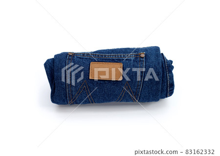 Rolled blue jeans on white background Rolled blue jeans on white background 83162332