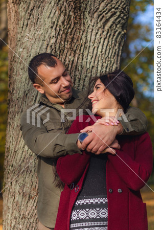 Lovely couple having fun together in nature. Lovely couple having fun together in nature. 83164434