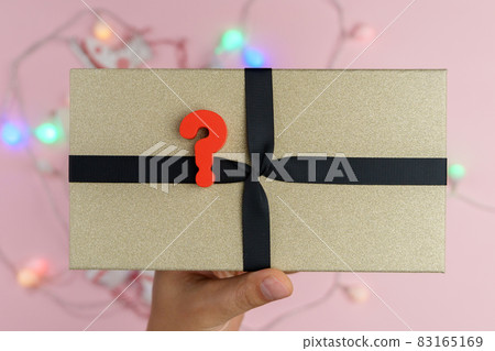 The concept of choosing and buying Christmas gifts. Christmas sale. Christmas and New Year gift. The concept of choosing and buying Christmas gifts. Christmas sale. Christmas and New Year gift. 83165169