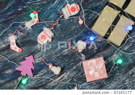 Gift boxes and Christmas decorations on black background. Top view 83165177