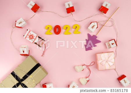 Christmas gift boxes Happy Christmas. Winter holiday theme. Happy New Year. Pink background. Flat lay Christmas gift boxes Happy Christmas. Winter holiday theme. Happy New Year. Pink background. Flat lay 83165178