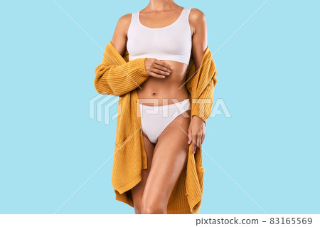 Closeup Of Woman Posing Isolated Over Blue Studio Background 83165569