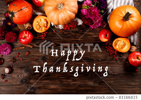 Autumnal composition with pumpkins on wooden table. November mood concept. Autumnal composition with pumpkins on wooden table. November mood concept. 83166815