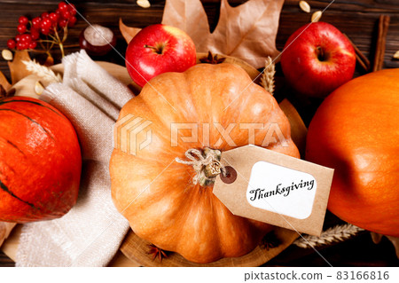 Autumnal composition with pumpkins on wooden table. November mood concept. Autumnal composition with pumpkins on wooden table. November mood concept. 83166816