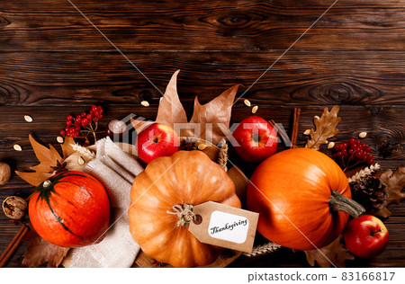 Autumnal composition with pumpkins on wooden table. November mood concept. 83166817