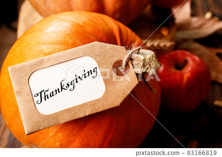 Autumnal composition with pumpkins on wooden table. November mood concept. 83166819