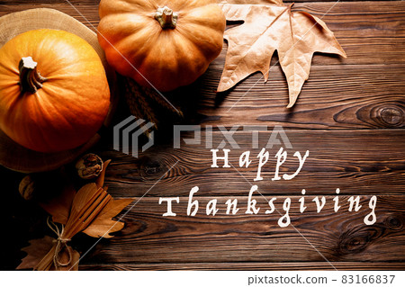 Autumnal composition with pumpkins on wooden table. November mood concept. Autumnal composition with pumpkins on wooden table. November mood concept. 83166837