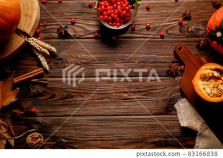 Autumnal composition with pumpkins on wooden table. November mood concept. Autumnal composition with pumpkins on wooden table. November mood concept. 83166838