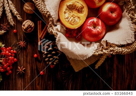 Autumnal composition with pumpkins on wooden table. November mood concept. Autumnal composition with pumpkins on wooden table. November mood concept. 83166843
