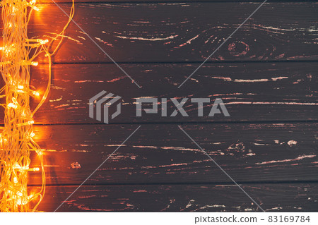 Christmas garland on wooden background with copy space 83169784