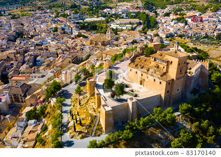 View from drone of of Caravaca de la Cruz overlooking Castle and Basilica, Spain View from drone of of Caravaca de la Cruz overlooking Castle and Basilica, Spain 83170140