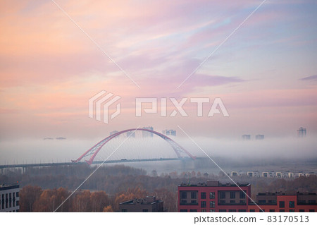 Bugrinsky bridge in winter foggy morning Bugrinsky bridge in winter foggy morning 83170513