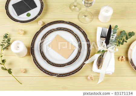 Table with plates and cutlery, view from above Table with plates and cutlery, view from above 83171134
