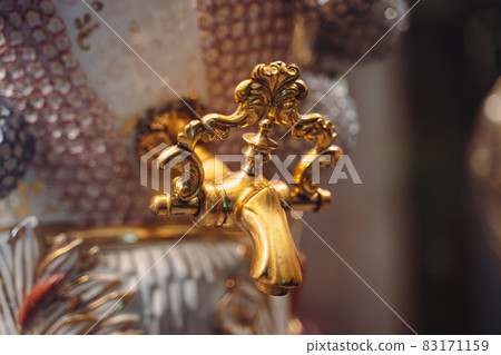closeup of gold plated spigot of glass samovar closeup of gold plated spigot of glass samovar 83171159