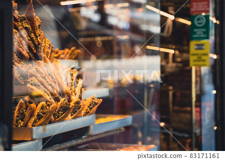 rows of Turkish baklava sweets lined up in window rows of Turkish baklava sweets lined up in window 83171161