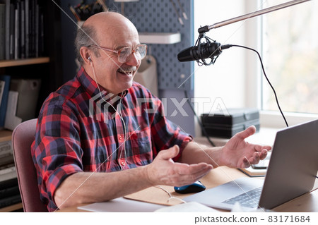 Smiling old elder grandfather talking to webcam on video chat sit at home Smiling old elder grandfather talking to webcam on video chat sit at home 83171684