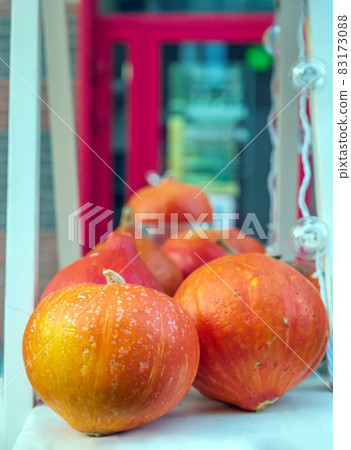 Pumpkins are on a shelf at the farmers' market. Halloween sale. Close-up. Pumpkins are on a shelf at the farmers' market. Halloween sale. Close-up. 83173088