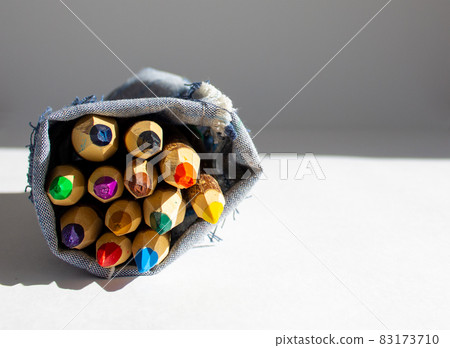 Bunch of pencils stylized tree branch. isolated on the white background in warm sunlight. 83173710