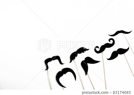 Paper party attributes in form of mustache on wooden stick. Carnival accessory concept. 83174083