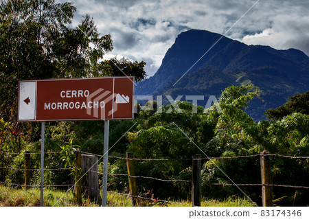 The famous Morrogacho Hill located on the beautiful Cocora Valley at the region of Quindio in Colombia. On the sign you can read: Morrogacho Hill 83174346