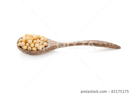 Soybeans in wood spoon isolated on white background with clipping path 83175175