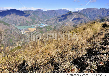 View of the mountains of Nishi Tanzawa, Lake Tanzawa and Miho Dam from the summit of Mt. Ono in the Tanzawa Mountains 83175457