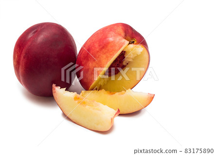 Ripe red nectarine and slices isolated on a white background Ripe red nectarine and slices isolated on a white background 83175890
