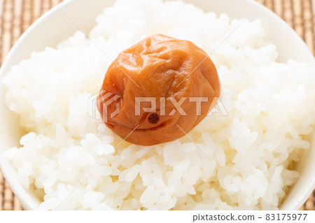 Honey plum (seasoned umeboshi) on rice. 83175977