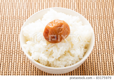 Honey plum (seasoned umeboshi) on rice. Honey plum (seasoned umeboshi) on rice. 83175979