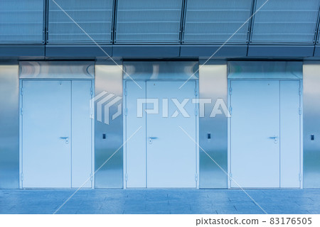 Three closed doors of the new industrial building. Three closed doors of the new industrial building. 83176505