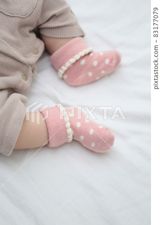 Half-year-old baby in socks 83177079