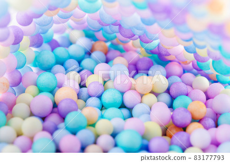 Foam beads of various colors brightly colored. 83177793