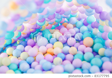 Foam beads of various colors brightly colored. 83177795