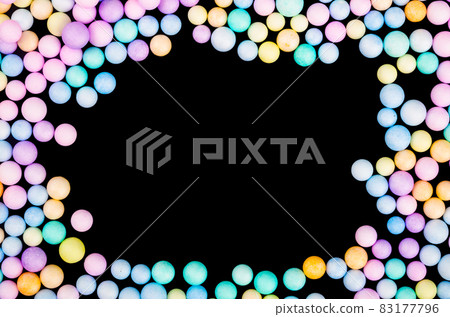 Foam beads of various colors brightly colored on black background. 83177796