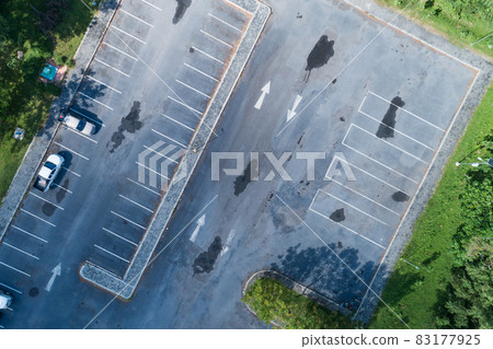 Aerial view top down of car parking lot with white line of traffic sign on the street. Above view of car in a row at parking space Outside car parking area 83177925