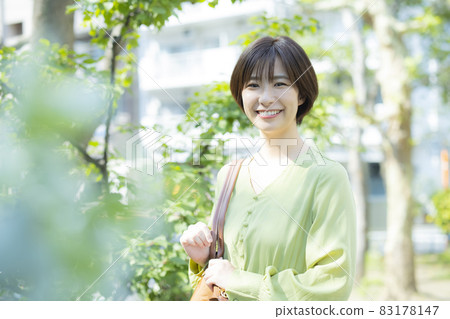 A woman walking outdoors A woman walking outdoors 83178147