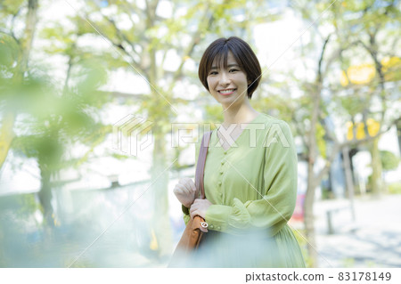A woman walking outdoors A woman walking outdoors 83178149