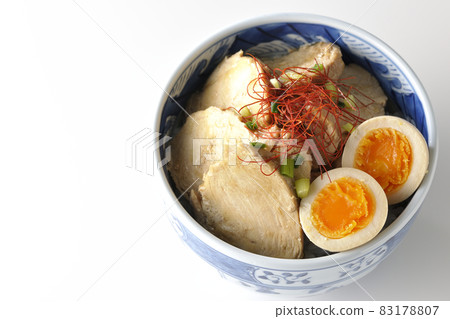 A bird's-eye view of a chicken char siu bowl with boiled eggs, all-purpose green onions and thread-cut chili peppers on a white background A bird's-eye view of a chicken char siu bowl with boiled eggs, all-purpose green onions and thread-cut chili peppers on a white background 83178807