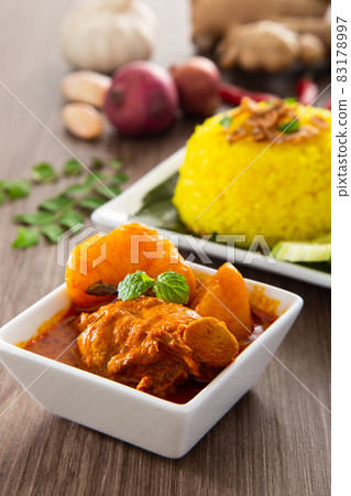 Nasi Kunyit also known as Turmeric Glutinous Rice. Normally eaten with dry curry chicken. Nasi Kunyit also known as Turmeric Glutinous Rice. Normally eaten with dry curry chicken. 83178997