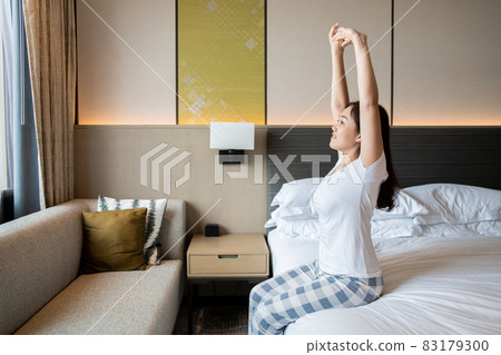 Woman just wake up from the bed. Woman just wake up from the bed. 83179300