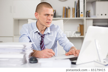 Portrait of manager dressed in the shirt Portrait of manager dressed in the shirt 83179415