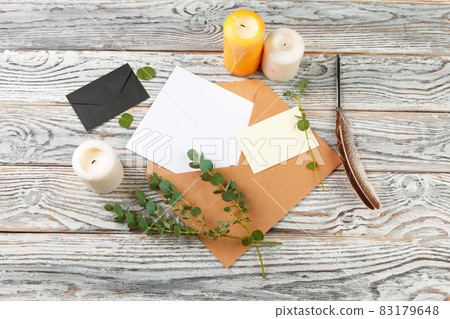 Top view of letter to Santa Claus concept. Paper on wooden background with holiday decorations Top view of letter to Santa Claus concept. Paper on wooden background with holiday decorations 83179648