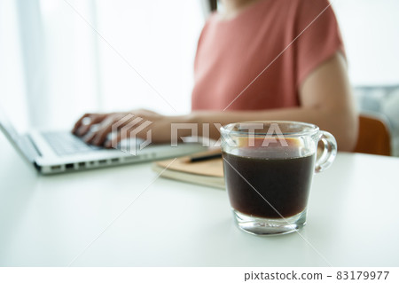 Woman working at home office. 83179977