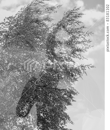 Portrait of young woman combined with photograph of tree and leaves. Creative. Double exposure, nature style. Portrait of young woman combined with photograph of tree and leaves. Creative. Double exposure, nature style. 83181102